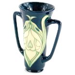 A Moorcroft pottery two handled vase, decorated with Art Nouveau motifs, made for the Moorcroft