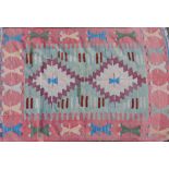WITHDRAWN PRE SALE BY VENDOR. A multicoloured Kilim rug, with all over geometric design in red,