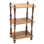 A Victorian walnut and marquetry three tier whatnot, with turned finials and supports, decorated