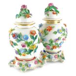 A pair of Dresden porcelain vases and covers, each with applied with flower encrusted decoration