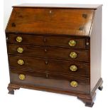 An early 19thC mahogany ebony strung and chequer banded bureau, the later top with a moulded edge,