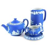 A collection of Wedgwood dark blue jasperware, to include a jug, teapot and cover, milk jug and a