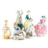 A quantity of porcelain, to include a pair of figures of a gentleman and lady each with a sheep, a