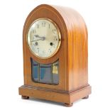 An Edwardian mahogany and boxwood strung lancet shaped mantel clock, with silver dial and leaded
