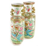 A pair of late 19thC Chinese Canton decorated two handled vases, each decorated with flowers,