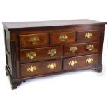 An early 19thC Lancashire mahogany chest, with a hinged top enclosing a vacant interior above