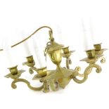 A brass six branch chandelier, with simulated candles in the Dutch style, 47cm wide.