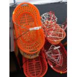 A collection of retro supermarket baskets, plastic covered wire pan stands, etc.