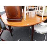 A 19thC mahogany oval drop leaf table.