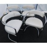 A set of four cream leatherette and chrome 1980's dining chairs. The upholstery in this lot does not