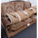 A Qualitas three seat sofa, upholstered in brown patterned draylon, a machine woven rug and a