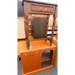 A mahogany side table with frieze drawer, on turned tapering legs and a teak hi-fi cabinet.