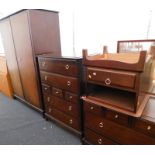 A Stag Minstrel bedroom suite, comprising a two door wardrobe, a chest of drawers, dressing table