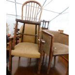 A collection of chairs, to include an open armchair, a tub chair, two stick back Windsor chairs, a