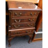 A small Georgian style mahogany chest of four drawers, on chest with cabriole legs and pad feet.