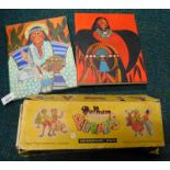 A Pelham puppet of a young girl in Scandinavian dress, boxed, and two canvas prints, possibly