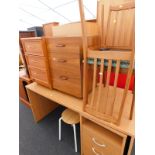 A collection of furniture, to include a desk with drawer unit, a pair of side chairs, two three