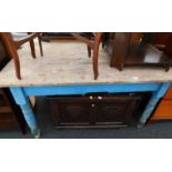 A Victorian pine scrub top kitchen table, with blue painted base and an oak blanket box.