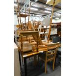 A pine kitchen table, three chairs, standard lamp, child's high chair, coffee table, bamboo table,