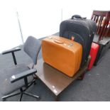 A collection of items, to include office chair, a coffee table, four suitcases, nest of three