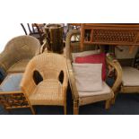 A collection of rattan and cane furniture, to include four chairs, tables, etc.