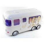 An MGA Entertainment Bratz Rock Angelz white tour bus, with a fitted interior, 56cm wide.