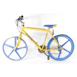 A British Eagle Kestin yellow and blue mountain bike, with 26" aluminium wheels, and 21 gears,