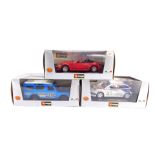 Three BB Burago Collection die cast cars, 1:24 scale, comprising a Ford Focus WRC., Land Rover