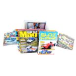 Scalextric Club Magazines, and further ephemera, in a Scalextric box.