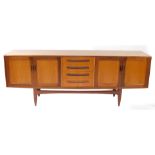 A G plan teak sideboard, with four central drawers flanked by two pairs of cupboard doors, raised on