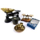 A set of bronze apothecary's bucket weights, or Pile de Charlemagne, a set of brass postal scales wi