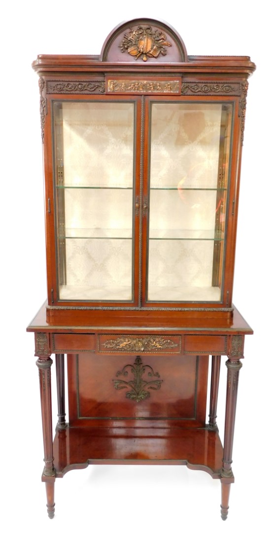 A late 19thC Louis XVI style mahogany vitrine, with metal mounts, the domed pediment cast centrally