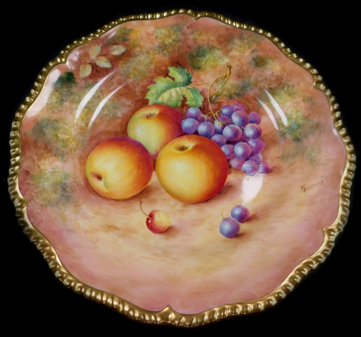 A Royal Worcester porcelain cabinet plate, signed Freeman, painted with apples and black grapes, 25