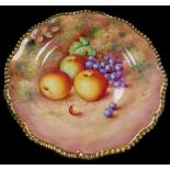 A Royal Worcester porcelain cabinet plate, signed Freeman, painted with apples and black grapes, 25