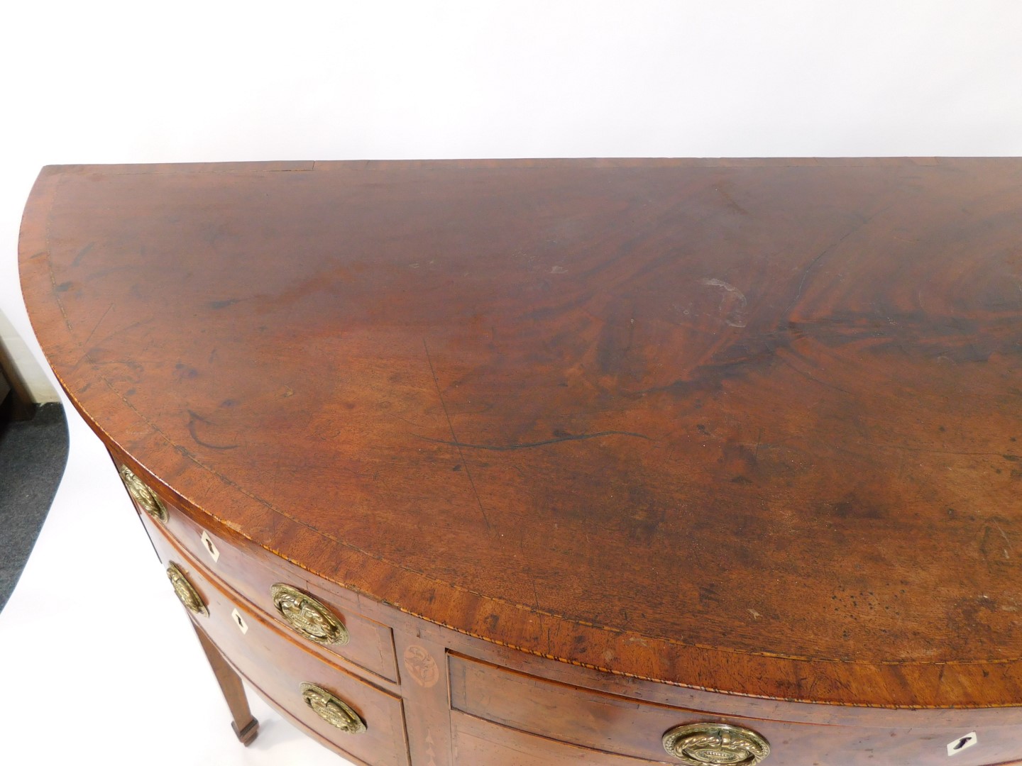 A George III mahogany demi lune sideboard, with cross banded and line inlaid top, an arrangement of - Image 3 of 11