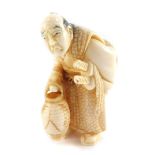 A Japanese Taisho period ivory figure carved as an old Samurai warrior, with a lantern, unsigned, 47