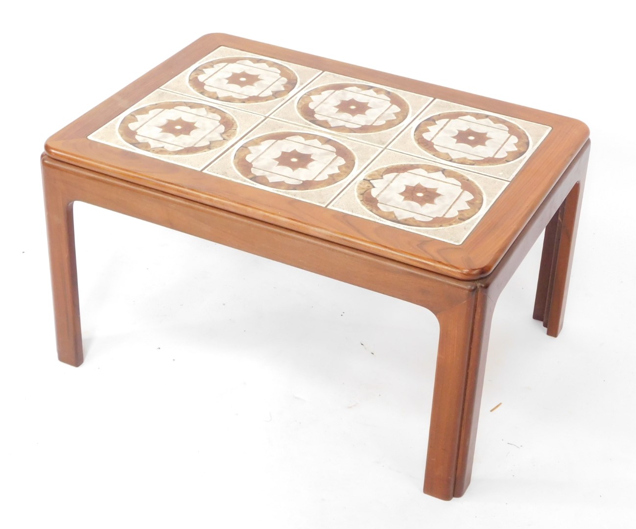A vintage late 20thC tile top teak coffee table, inset with six brown floral tiles, raised on chamfe