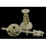 A Chinese Qing dynasty ivory puzzle ball, carved to the outer ball with figures and pagodas, with a