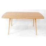 An Ercol light elm and ash plank topped dining table, design by Luciane Ercolani, raised on tapering