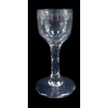 A George III wine glass, the ovoid bowl engraved with a band of stars interspersed with circles, rai