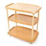 An Ercol light elm and ash Golden Torque Dawn tea trolley, of three tier form, raised on castors, 77