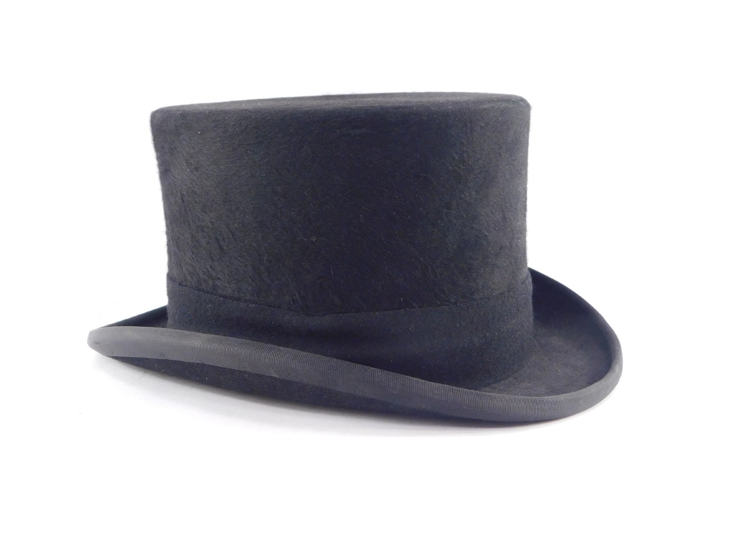A Christies of London black top hat, inner circumference 57cm.