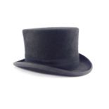 A Christies of London black top hat, inner circumference 57cm.