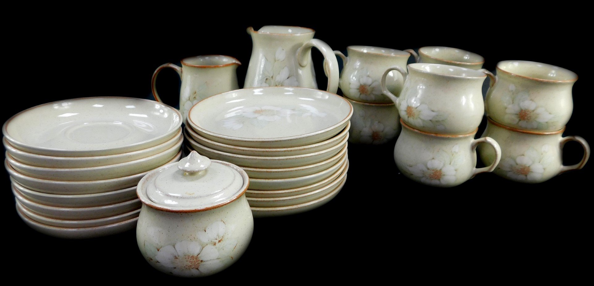 A Denby pottery part tea service decorated in the Daybreak pattern, comprising milk and cream jugs,