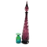 An Empoli vintage amethyst glass bottle and stopper, of spiral fluted form, 66cm high, together with