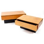 A pair of vintage teak and ebonised graduated coffee tables, the smaller with a frieze drawer, the l