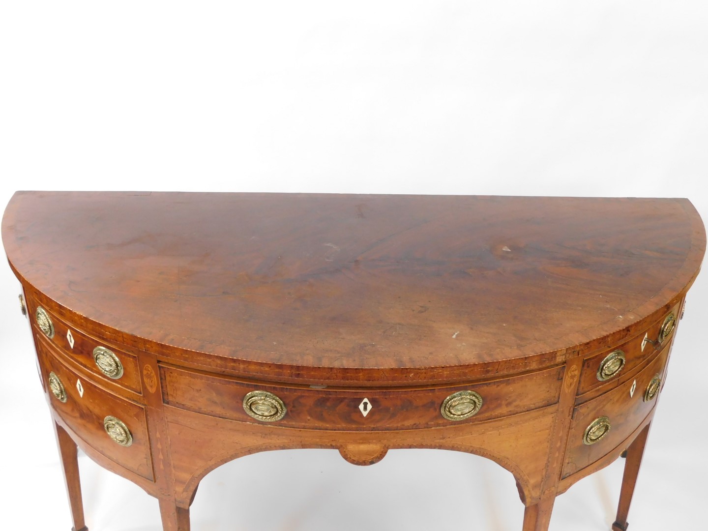 A George III mahogany demi lune sideboard, with cross banded and line inlaid top, an arrangement of - Image 2 of 11