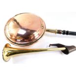 A Victorian copper warming pan, with ebonised handle and a period brass and silver plated post horn,