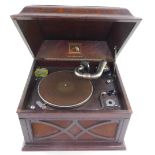 An HMV oak cased table top gramophone, 33cm high, 44.5cm wide, 38cm deep.