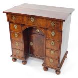 An early 18thC and later adapted walnut kneehole bachelor's secretaire chest, with folding top and r